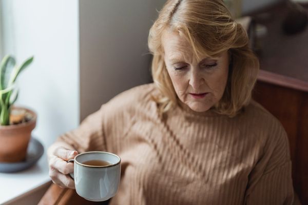 A woman relaxing with a cup of tea