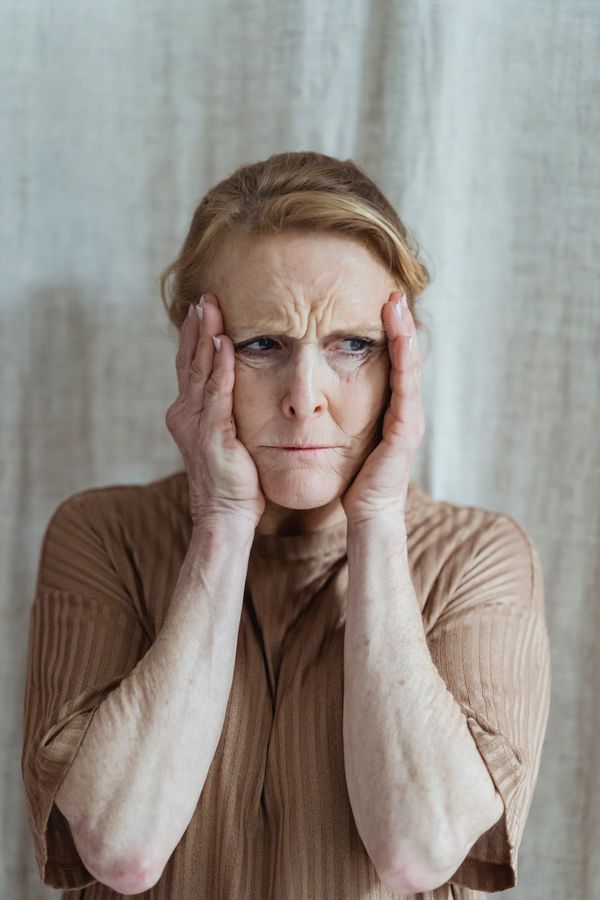 A woman struggling to concentrate