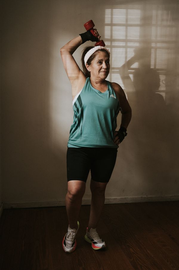 A woman lifting a dumbbell