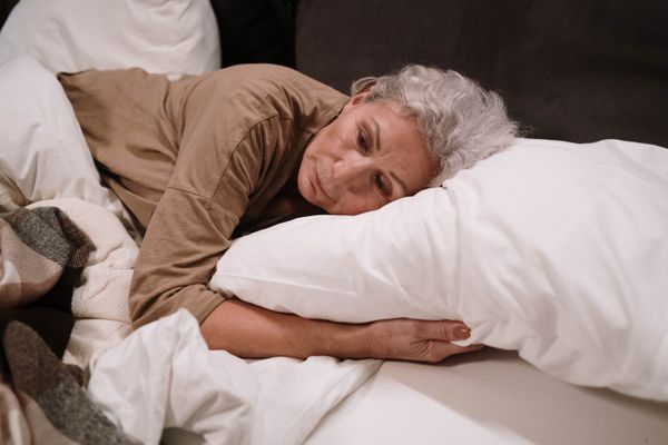 A woman lying awake at night