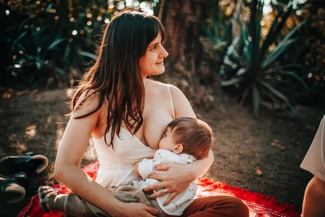 A mother breastfeeding her baby