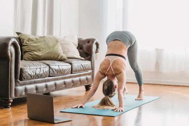A woman practising yoga at home